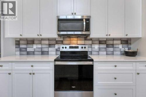380 Rivercrest View, Cochrane, AB - Indoor Photo Showing Kitchen