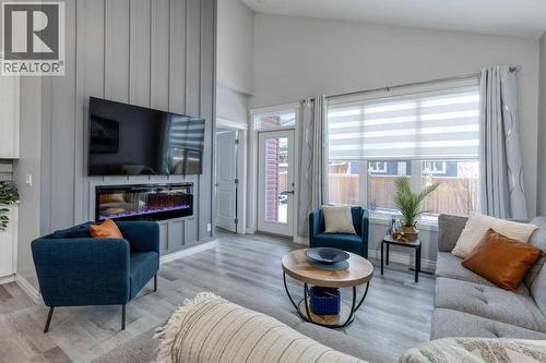 380 Rivercrest View, Cochrane, AB - Indoor Photo Showing Living Room