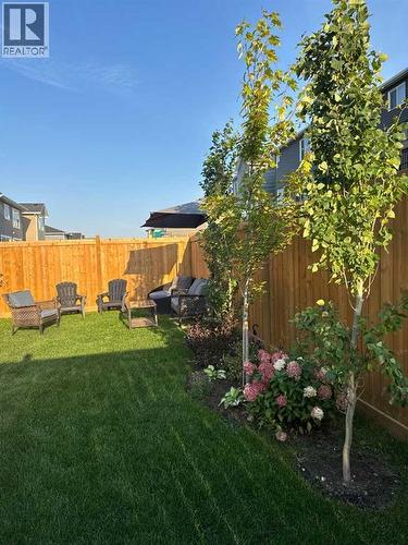 Lots of great trees and shrubs have been planted - 380 Rivercrest View, Cochrane, AB - Outdoor
