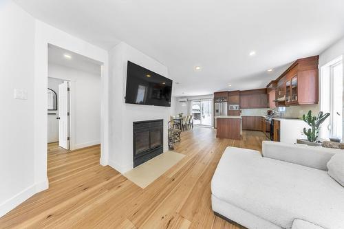 Vue d'ensemble - 21 154E Avenue, Saint-Hippolyte, QC - Indoor Photo Showing Living Room With Fireplace