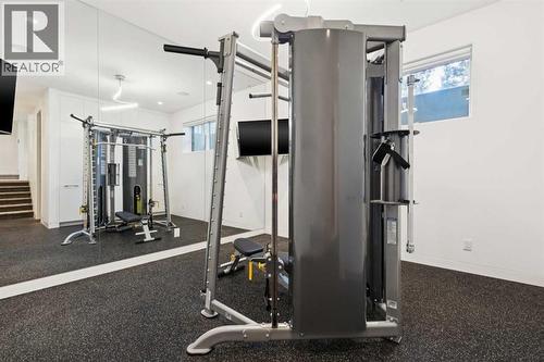 LOWER LEVEL SPACE...CURRENTLY BEING USED AS FITNESS AND WITH RUBBER FLOOR - 530 Crescent Road Nw, Calgary, AB - Indoor Photo Showing Gym Room