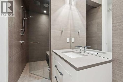 ADJACENT BATHROOM WITH LARGE SHOWER WITH BENCH AND STEAM - 530 Crescent Road Nw, Calgary, AB - Indoor Photo Showing Bathroom