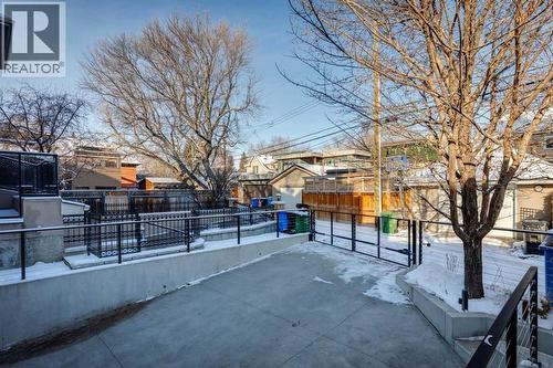 REAR DRIVEWAY TO DOUBLE GARAGE.  GARAGE APPROACH IS HEATED AND ELECTRONIC GATE AT THE REAR FOR SECURITY - 530 Crescent Road Nw, Calgary, AB - Outdoor