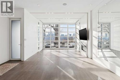 STUNNING VIEWS FROM THE MAIN FLOOR PRINCIPAL ROOMS. HEATED FLOORS THROUGHOUT THE MAIN LEVEL - 530 Crescent Road Nw, Calgary, AB - Indoor Photo Showing Other Room