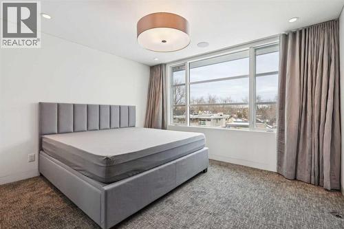 THIRD BEDROOM WITH BUILT-IN BED FRAME - 530 Crescent Road Nw, Calgary, AB - Indoor Photo Showing Bedroom