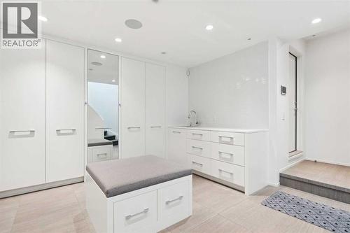 HUGE MUDROOM WITH CENTRE ISLAND, SINK AND AMAZING STORAGE - 530 Crescent Road Nw, Calgary, AB - Indoor Photo Showing Other Room
