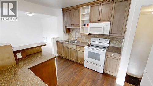 1505 8 Avenue S, Lethbridge, AB - Indoor Photo Showing Kitchen With Double Sink