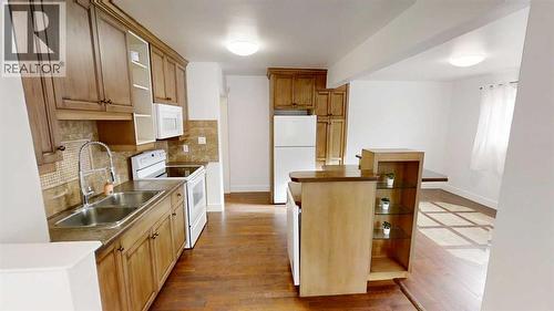 1505 8 Avenue S, Lethbridge, AB - Indoor Photo Showing Kitchen With Double Sink