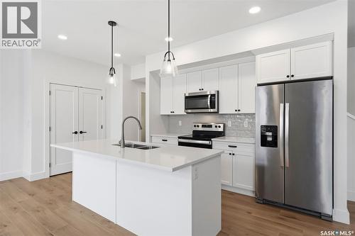 307 Keith Union, Saskatoon, SK - Indoor Photo Showing Kitchen With Stainless Steel Kitchen With Double Sink With Upgraded Kitchen