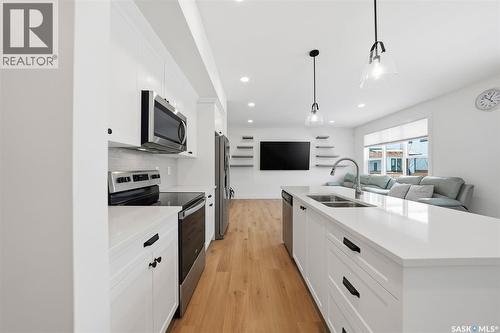 307 Keith Union, Saskatoon, SK - Indoor Photo Showing Kitchen With Double Sink With Upgraded Kitchen