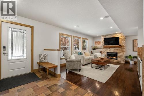 250 Lake Fraser Place Se, Calgary, AB - Indoor Photo Showing Living Room With Fireplace