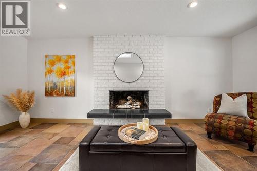 250 Lake Fraser Place Se, Calgary, AB - Indoor Photo Showing Living Room With Fireplace