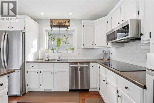 188 Millrise Drive Sw, Calgary, AB - Indoor Photo Showing Kitchen With Stainless Steel Kitchen With Double Sink With Upgraded Kitchen