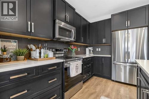 146 Marquis Common Se, Calgary, AB - Indoor Photo Showing Kitchen With Upgraded Kitchen