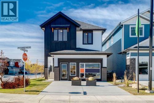 128 Quartz Crescent, Cochrane, AB - Outdoor With Facade