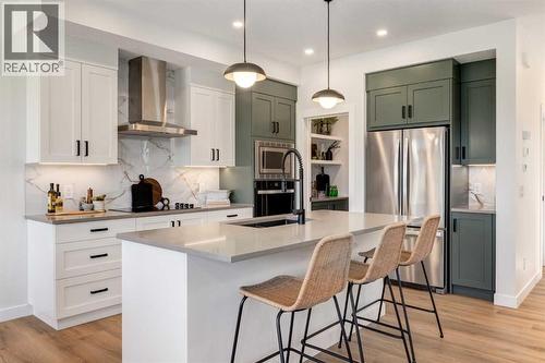 128 Quartz Crescent, Cochrane, AB - Indoor Photo Showing Kitchen With Stainless Steel Kitchen With Upgraded Kitchen