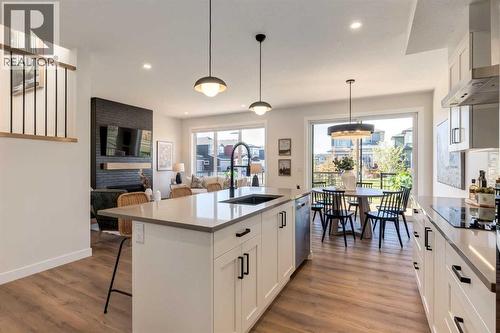 128 Quartz Crescent, Cochrane, AB - Indoor Photo Showing Kitchen With Upgraded Kitchen