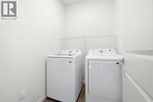 185 Edith Green Nw, Calgary, AB - Indoor Photo Showing Laundry Room