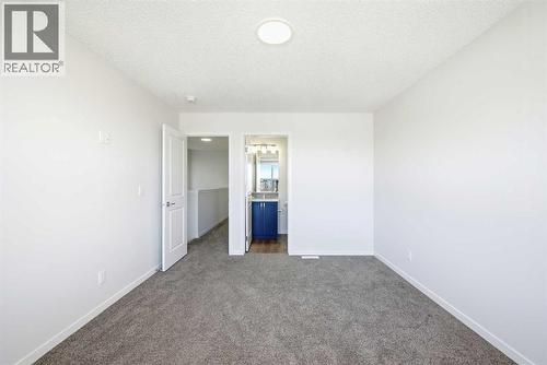 185 Edith Green Nw, Calgary, AB - Indoor Photo Showing Other Room