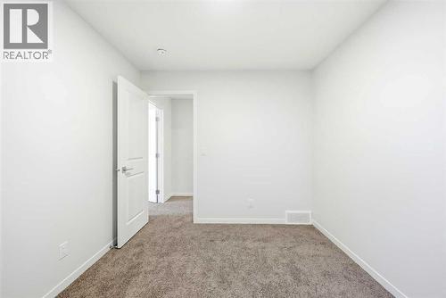 185 Edith Green Nw, Calgary, AB - Indoor Photo Showing Other Room