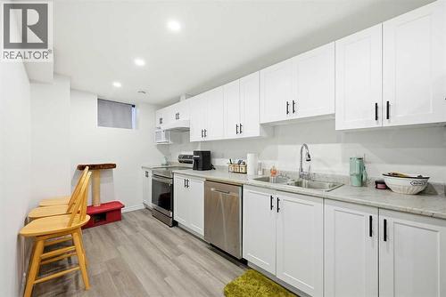 185 Edith Green Nw, Calgary, AB - Indoor Photo Showing Kitchen With Double Sink