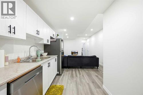 185 Edith Green Nw, Calgary, AB - Indoor Photo Showing Kitchen With Double Sink