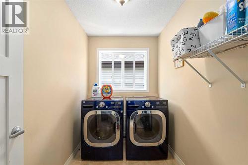 Upper laundry room - 112 Sunset View, Cochrane, AB - Indoor Photo Showing Laundry Room