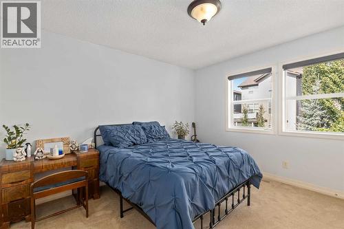 Upper bedroom 3 - 112 Sunset View, Cochrane, AB - Indoor Photo Showing Bedroom