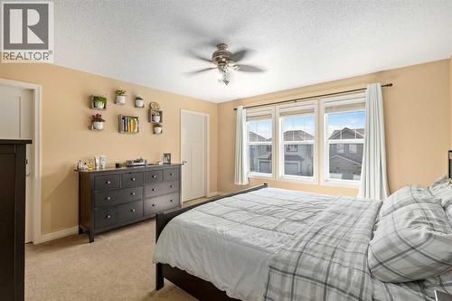 112 Sunset View, Cochrane, AB - Indoor Photo Showing Bedroom
