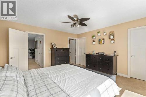 112 Sunset View, Cochrane, AB - Indoor Photo Showing Bedroom