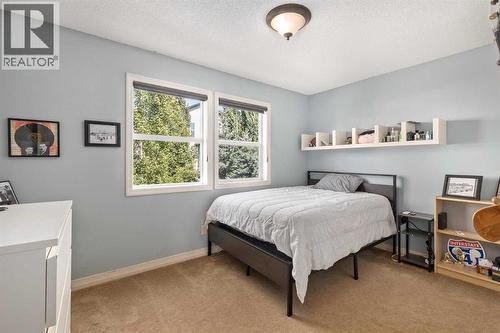 112 Sunset View, Cochrane, AB - Indoor Photo Showing Bedroom