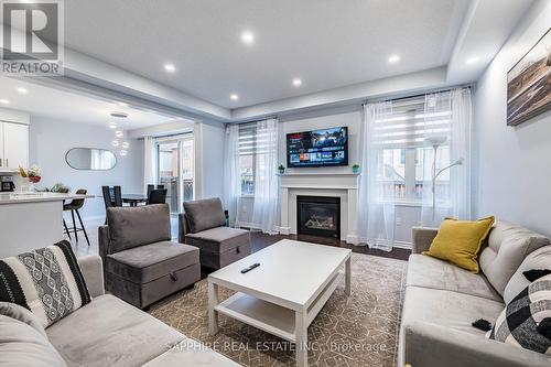 325 Trudeau Drive E, Milton, ON - Indoor Photo Showing Living Room With Fireplace