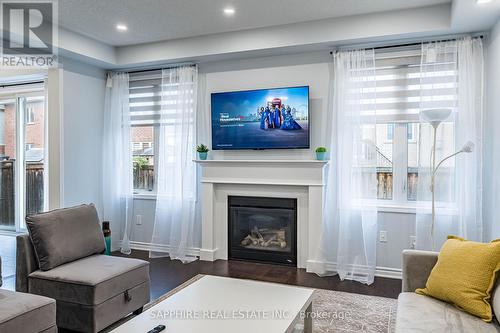 325 Trudeau Drive E, Milton, ON - Indoor Photo Showing Living Room With Fireplace