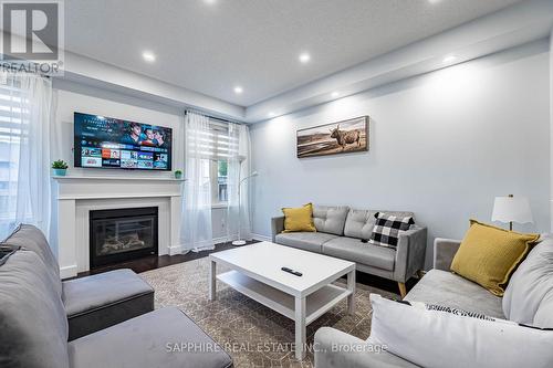325 Trudeau Drive E, Milton, ON - Indoor Photo Showing Living Room With Fireplace