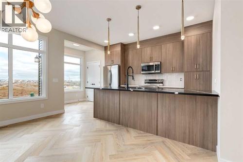 466 River Avenue, Cochrane, AB - Indoor Photo Showing Kitchen With Upgraded Kitchen