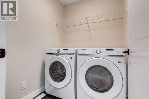 466 River Avenue, Cochrane, AB - Indoor Photo Showing Laundry Room