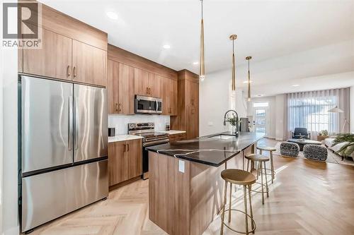 94 Agate Road, Cochrane, AB - Indoor Photo Showing Kitchen With Upgraded Kitchen