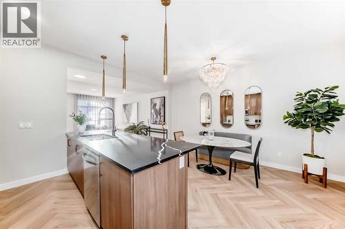 94 Agate Road, Cochrane, AB - Indoor Photo Showing Kitchen With Double Sink
