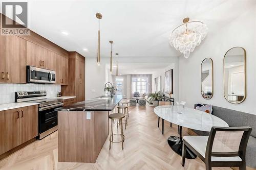 94 Agate Road, Cochrane, AB - Indoor Photo Showing Kitchen With Upgraded Kitchen