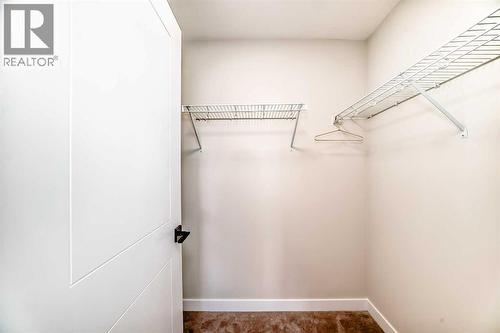 94 Agate Road, Cochrane, AB - Indoor With Storage