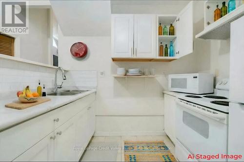Lower Kitchen Staged - 376 Hansen Road N, Brampton (Madoc), ON - Indoor Photo Showing Kitchen With Double Sink
