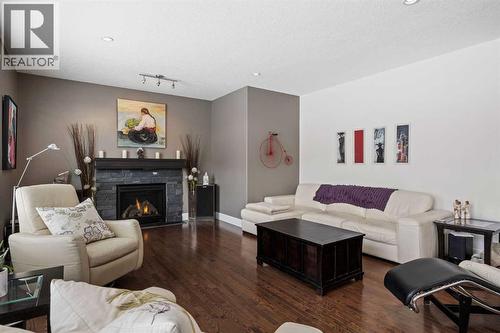 184 Magenta Crescent, Chestermere, AB - Indoor Photo Showing Living Room With Fireplace