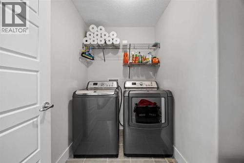 Upstairs Laundry - 184 Magenta Crescent, Chestermere, AB - Indoor Photo Showing Laundry Room