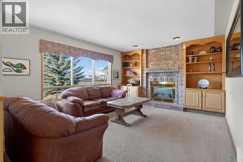 116 Hampshire Grove Nw, Calgary, AB - Indoor Photo Showing Living Room With Fireplace
