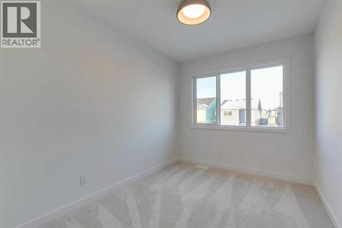 98 Agate Road, Cochrane, AB - Indoor Photo Showing Other Room