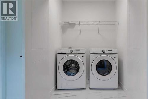 98 Agate Road, Cochrane, AB - Indoor Photo Showing Laundry Room