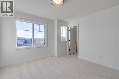 98 Agate Road, Cochrane, AB - Indoor Photo Showing Other Room