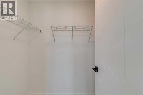 98 Agate Road, Cochrane, AB - Indoor With Storage