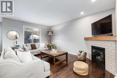 31 St Moritz Terrace Sw, Calgary, AB - Indoor Photo Showing Living Room With Fireplace