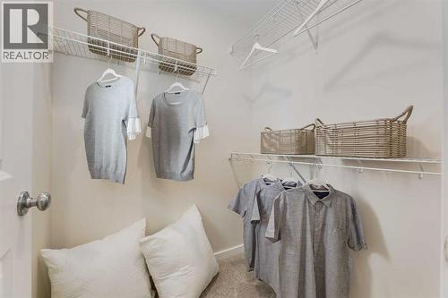 PLEASE NOTE: Photos are of a finished Showhome of the same model – fit and finish may differ on finished spec home. Interior selections and floorplans shown in photos - 62 Starling Boulevard Nw, Calgary, AB - Indoor With Storage